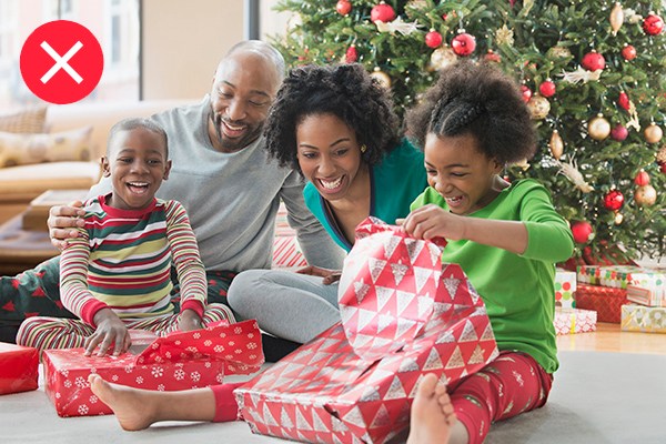 Family opening Christmas presents together