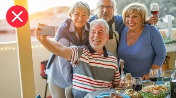 happy-seniors-friends-taking-selfie-260nw-1033504639
